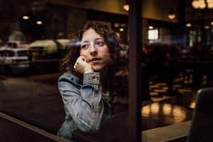 A woman being patient waiting for her Miami business to take off.