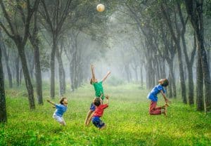 Children playing in the rain