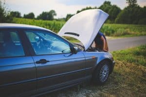 A man fixing his car.