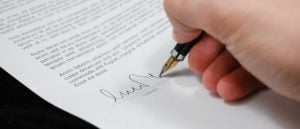 A person signing a contract