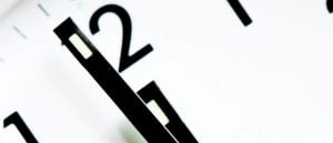 A clock showing a minute to twelve