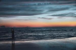 Person on seashore during golden hour