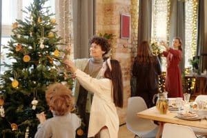 Family decorating a christmas tree