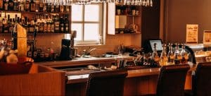 a picture of an empty restaurant bar as one of the consequences of restaurant relocation