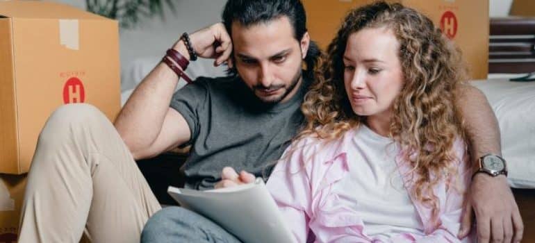 Couple making a checklist to prepare for movers