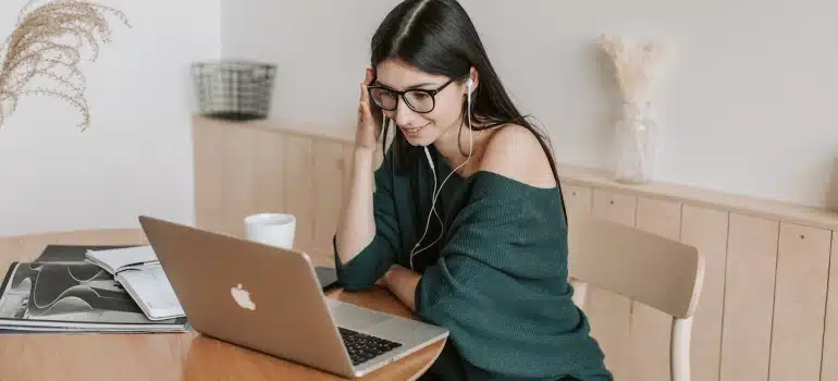 a woman on a laptop making an inventory list