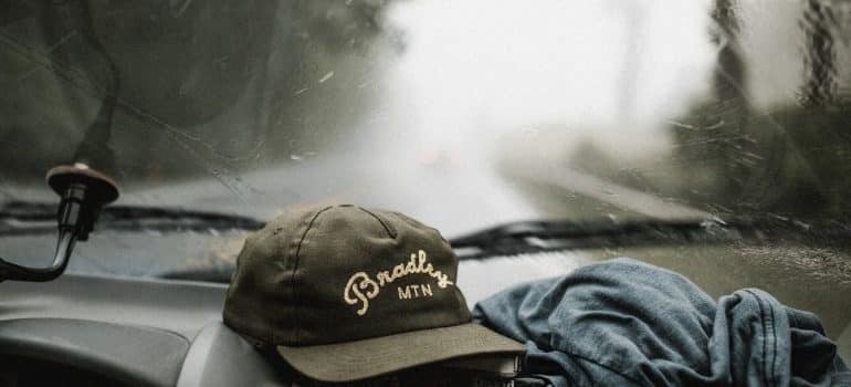 A hat in the truck that is on the road while moving a small business to Miami