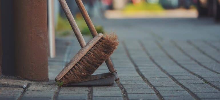 Dustpan and broom on concrete