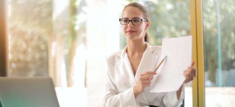 Woman holding a plan.