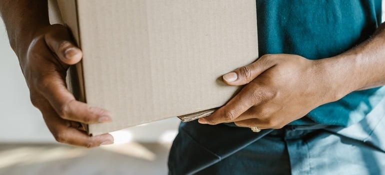 holding a moving box