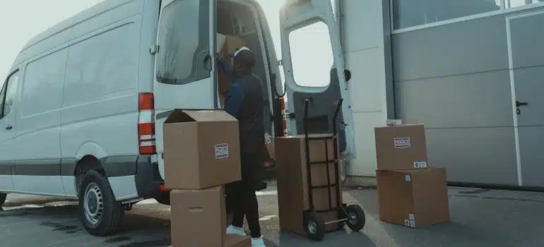 Delivery Man getting Packages from a Van