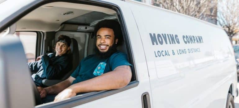 Men driving in a moving van