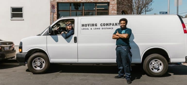 Movers in front of a moving van