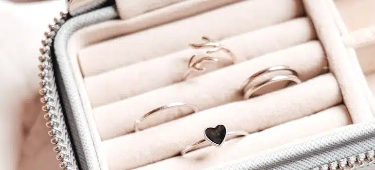 Several rings in a padded white pouch