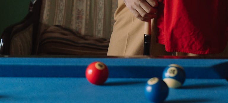 person at a pool table