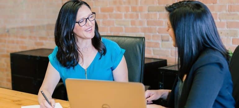 two people talking in an office