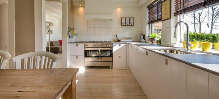 Kitchen room with a wooden floor and kitchen and dinning room furniture