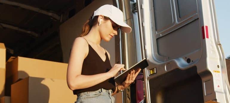 woman evaluating moving cargo