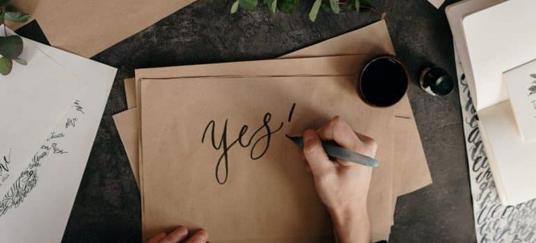 Woman writing on a peace of paper