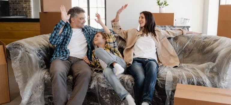 a family with moving boxes