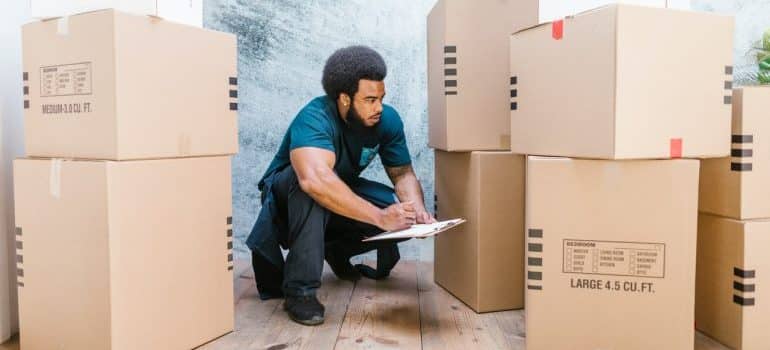 Professional mover with boxes.