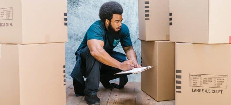 one of the white glove movers, doing inventory