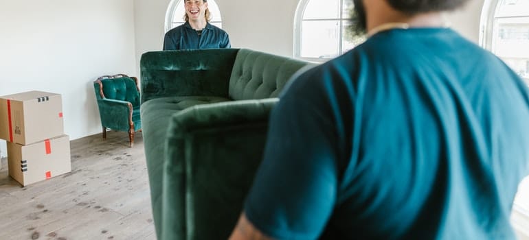 movers carrying a sofa
