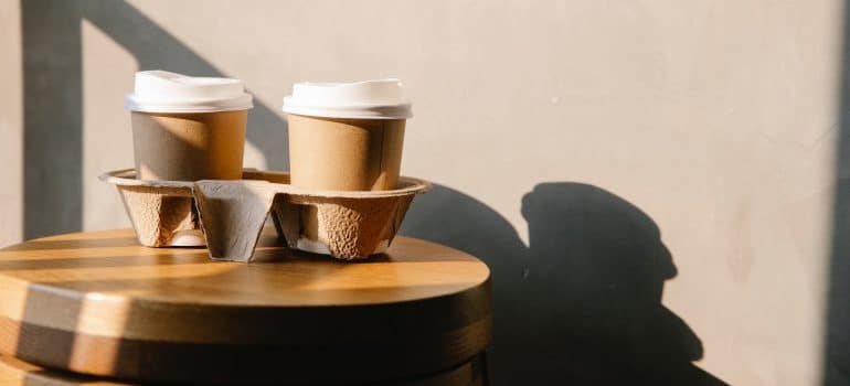 Two cardboard mugs of coffee