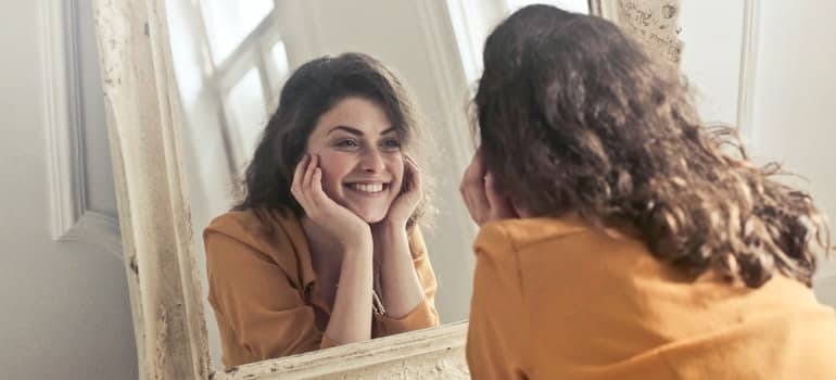 A girl looking at a mirror