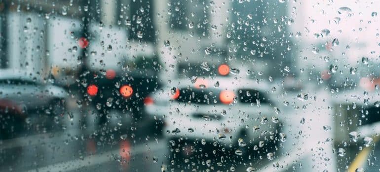 Rain drops in clear glass panel