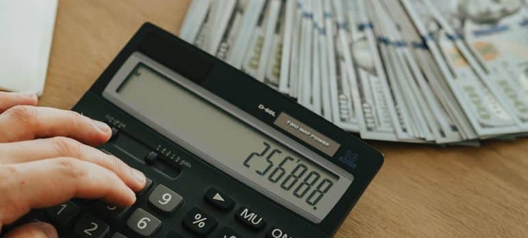 black calculator and money on the table