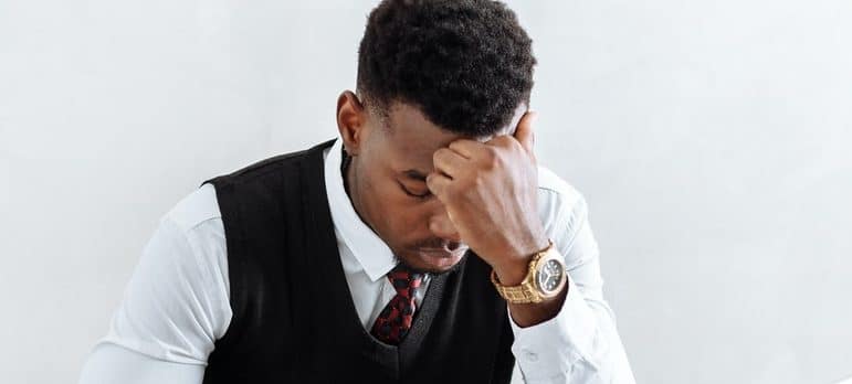 man stressing out about how to maintain productivity when moving office in Miami