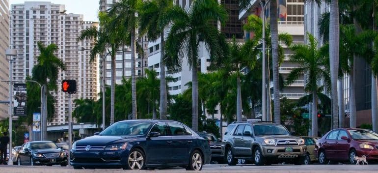 People in cars purchasing an investment property in Downtown Miami