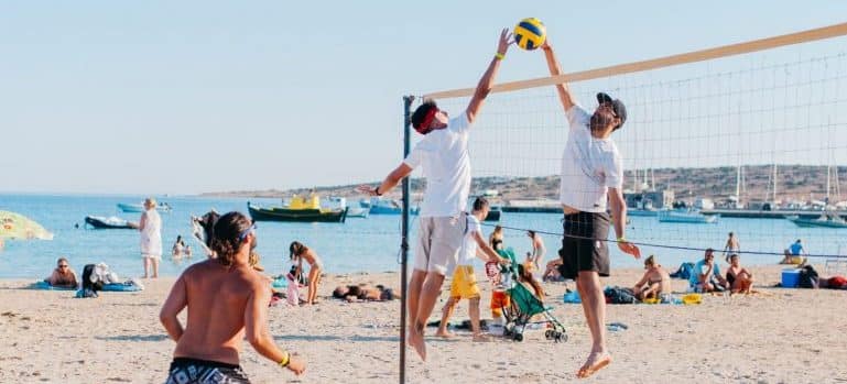 People playing beach volleyball in Miami