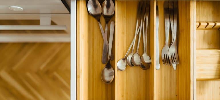 Forks and spoons in a kitchen drawer