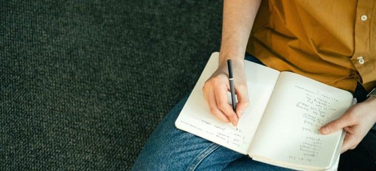 A woman creating a list of things to do