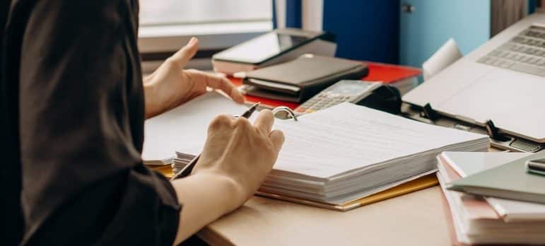 a woman reading documents