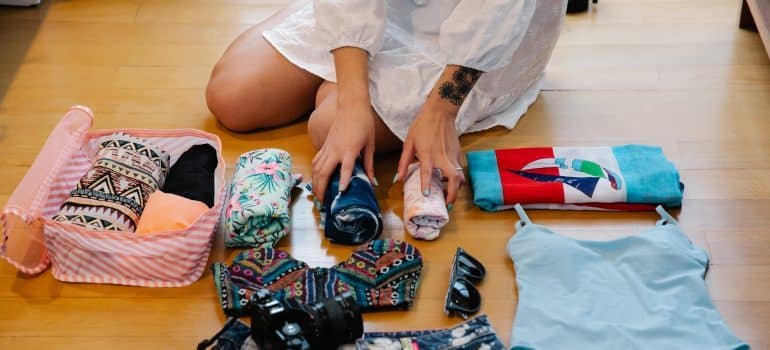 A woman is packing her items