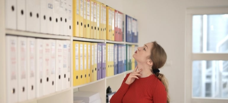 A person looking for certain documentation in the archives.