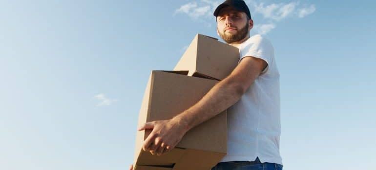 mover carrying cardboard boxes