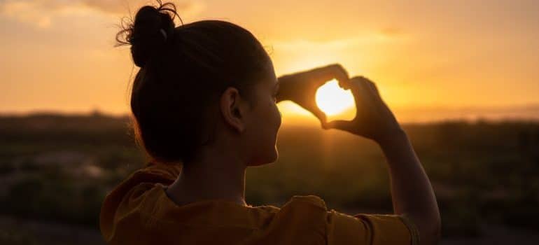 Woman doing hand heart