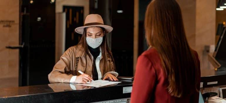 woman signing the contract