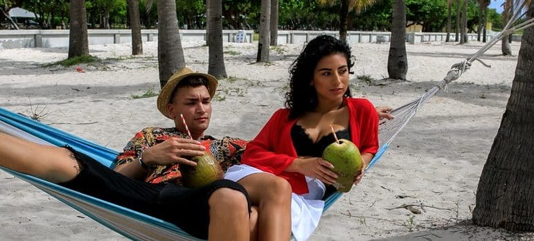 a couple lying on the hammock