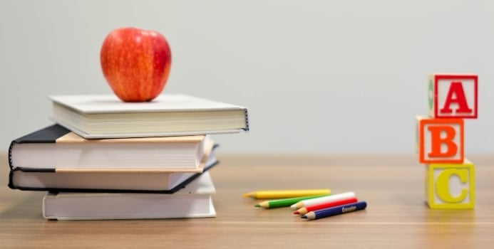 Books and an apple on the desk