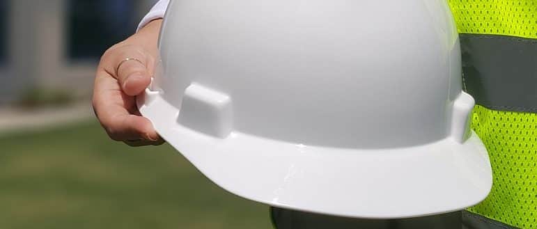 Man holding a safety helmet