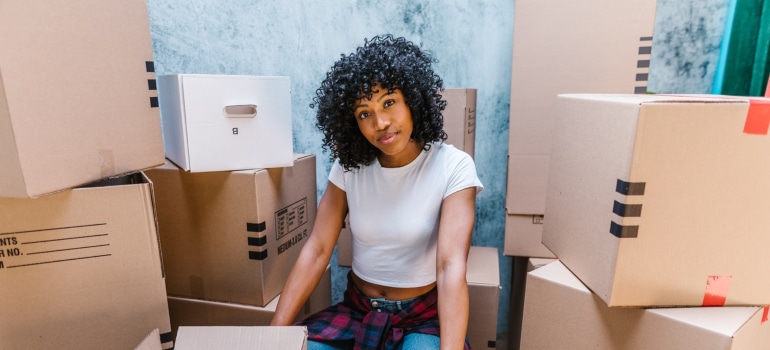 a girl gathering packing supplies before moving a pool table with ease