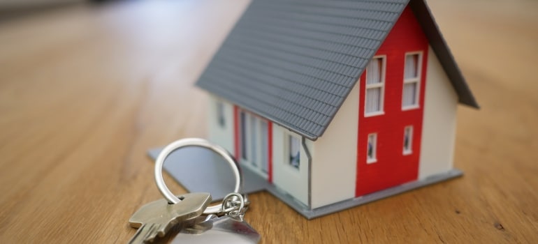 A model house and a key on the table