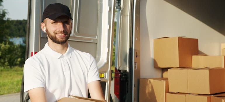 Man carrying boxes.