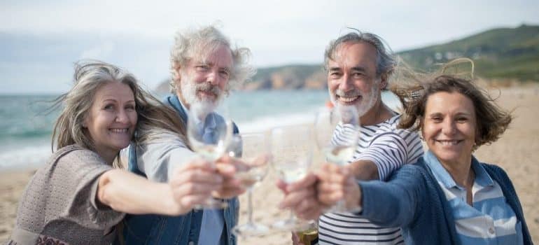 people toasting and talking about