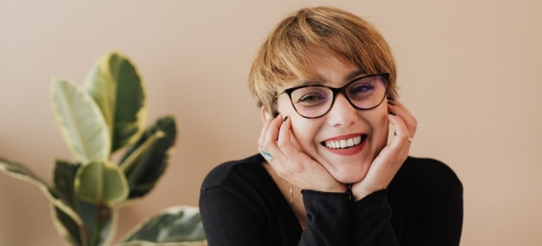 Cheerful woman smiling in an office space